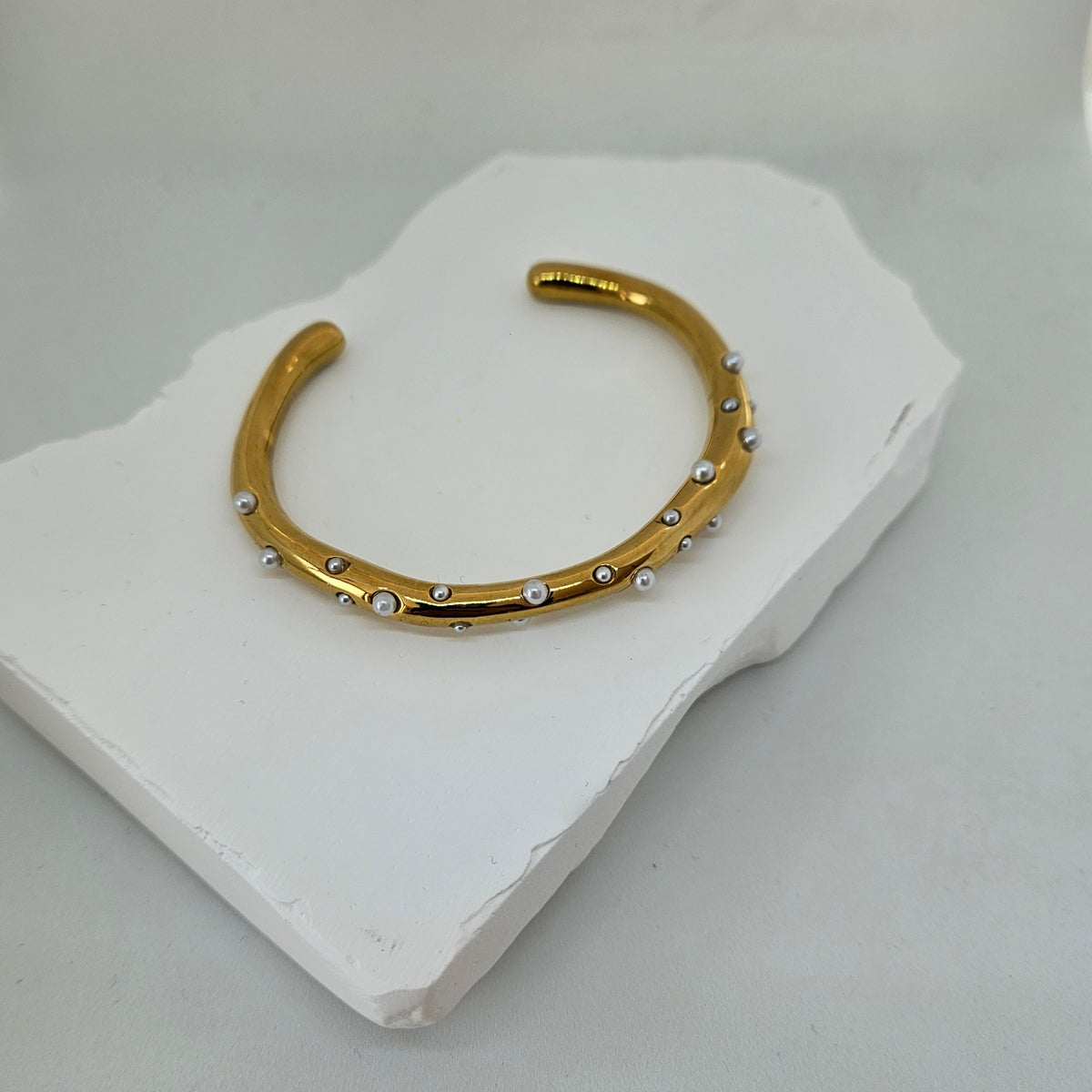 Cuff bracelet with pearls photo