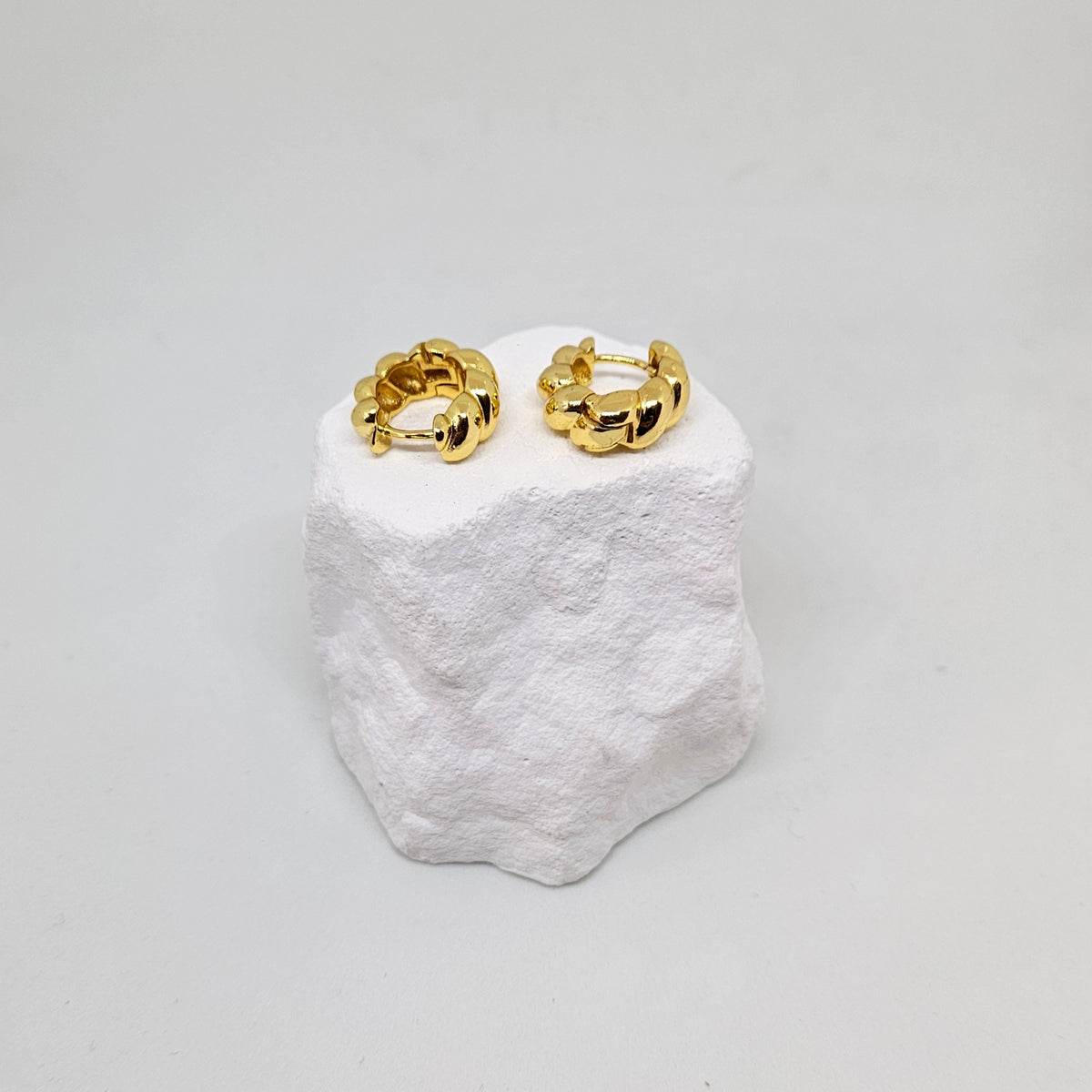 Gold statement hoop earrings photo