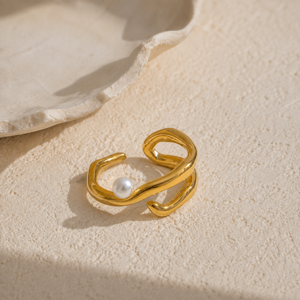 Gold statement ring with a pearl