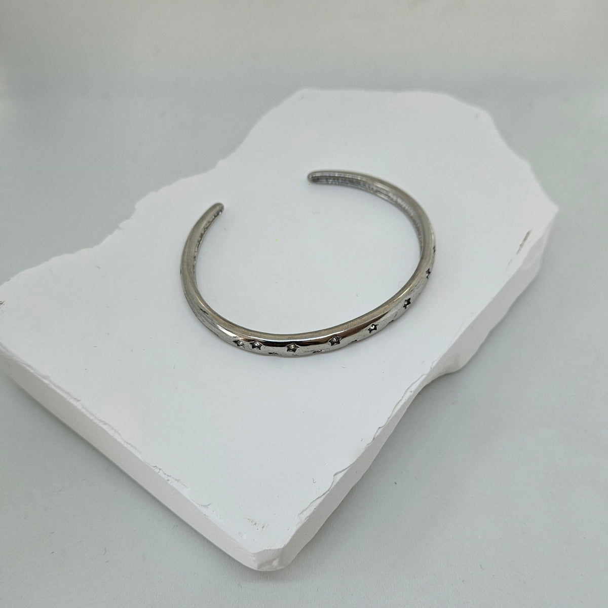 Silver bracelet with white stars photo